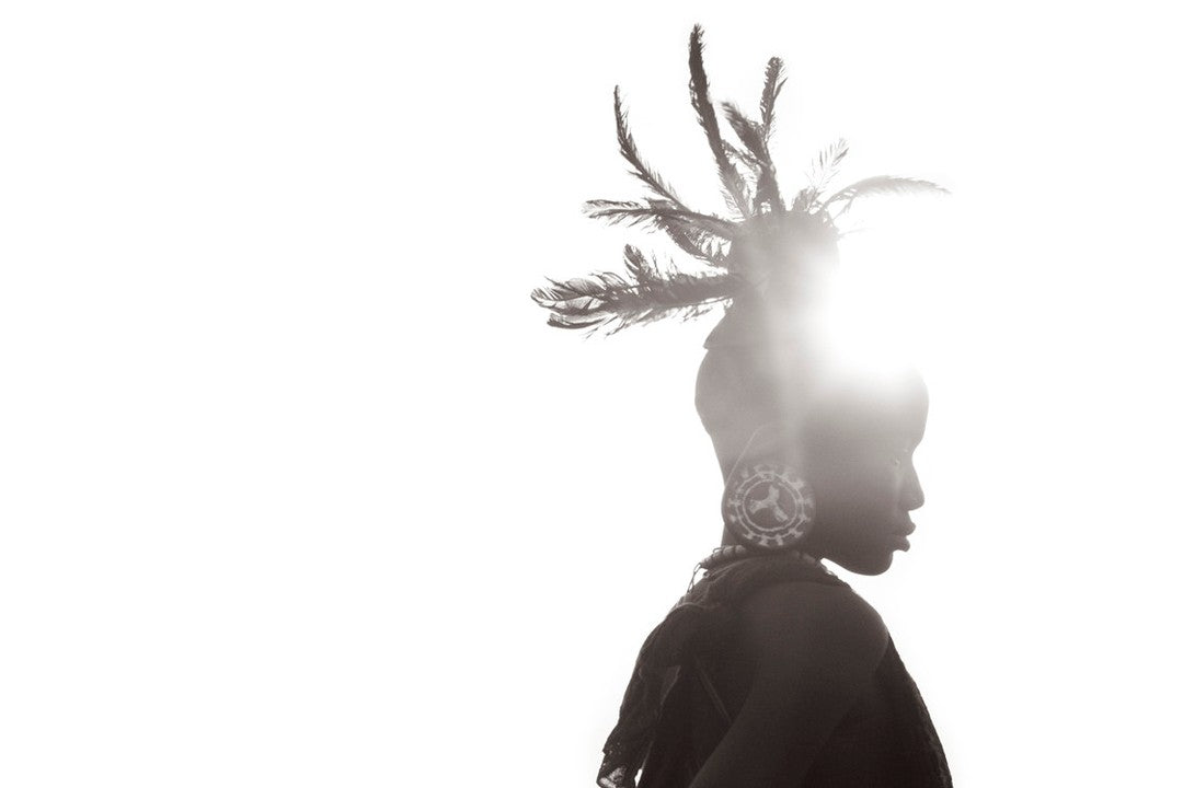 Tribal silhouette sun feathers